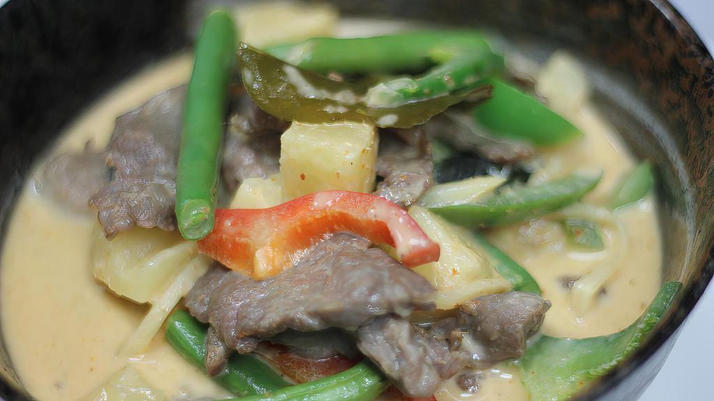 Pineapple Curry · Red curry with coconut milk, pineapple chunks, bell peppers, string beans, bamboo shoot, and basil. Served with steamed jasmine rice. Spicy lowest level mild.