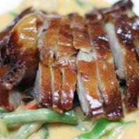 Duck Curry · Crispy tender duck with longan fruit, string beans, bell peppers, and basil in red curry sau...