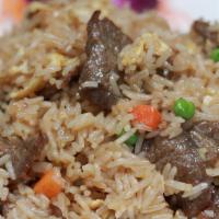 Traditional Fried Rice · Original fried rice with onion, carrot peas, garlic, and egg.