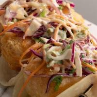 Fish Tacos · beer battered cod, red cabbage slaw, aoli, avacado crema, scallions cilantro