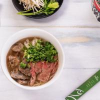 Pho · Tai-rare beef slices “classic”, beef tripe, beef tendon, cilantro, rice noodle, green onion,...