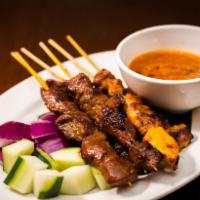 Satay Chicken · Hot & Spicy. Marinated charcoal grill chicken on a skewer, served with peanut sauce.