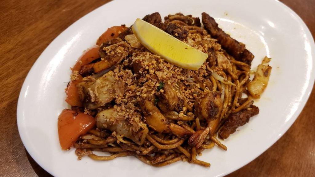 Indian Mee Goreng · Hot & Spicy. Indian style stir-fried egg noodle with shrimp sprinkled with grounded peanut and sesame.