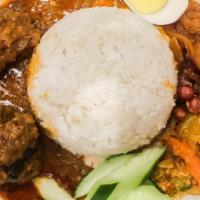 Nasi-Lemak · Hot & Spicy. Curry chicken, pickles, anchovies, eggs, cucumber and peanut serve with coconut...