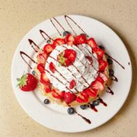 Waffle With Fresh Fruits · Topped with whipped cream.