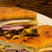 Cubano Wedge · House smoked pork loin, ham, Swiss, house pickles and mustard (wedge only).