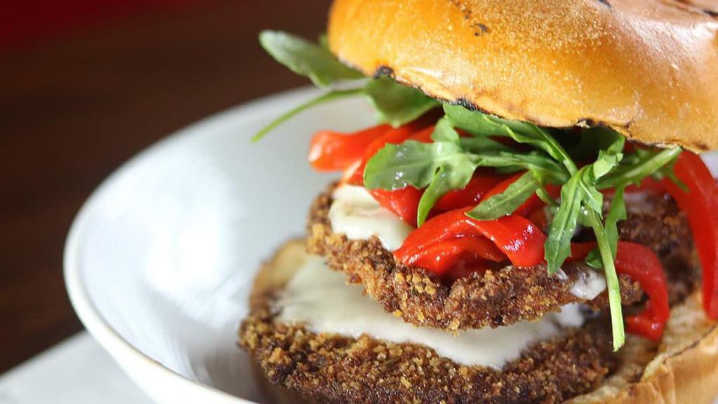 Eggplant & Roasted Peppers Sandwich · Smothered in mozzarella and romesco sauce. 

Contains nuts.