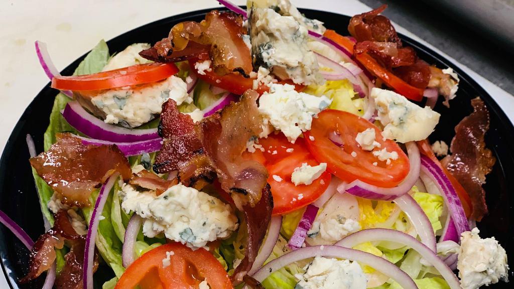 Wedge Salad · Bacon, tomato, blue cheese.