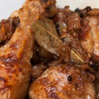 Adobo Chicken · Stewed chicken in soy sauce, vinegar, garlic with whole black pepper, onion, and bay bay lea...