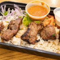 Lamb Shish · Char-grilled cubes of baby lamb on a skewer.