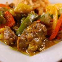 Small Curried Goat · Goat meat cut into small pieces, well seasoned and cooked with aromatic spices and herbs

Pl...
