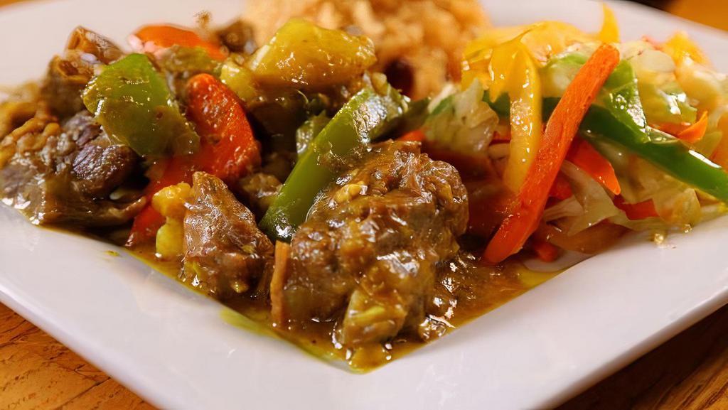 Small Curried Goat · Goat meat cut into small pieces, well seasoned and cooked with aromatic spices and herbs

Please specify which rice (rice & peas, pumpkin rice or white rice) you would like with your goat meat.