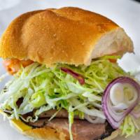 Small Roast Beef And Cheese Sub · Served on Kaiser Roll, Roast Beef and Choice Of Cheese and Toppings.