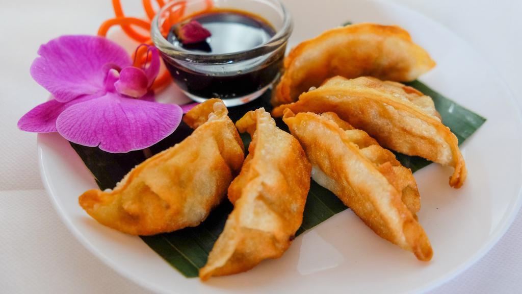 Gyoza · Pork dumplings. Fried ground pork with vegetables. Served with sweet soy sauce.