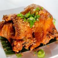 Thai Herbed Chicken Wing · Deep fried special marinated wings served with authentic Thai Sriracha sauce