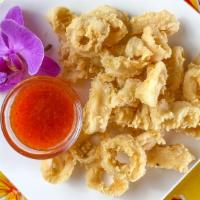 Crispy Calamari Fritters · Crispy fried golden calamari served with sweet Thai chili sauce.