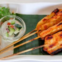 Chicken Satay · Grilled marinated chicken on skewers, served with peanut sauce, cucumber relish, and grilled...