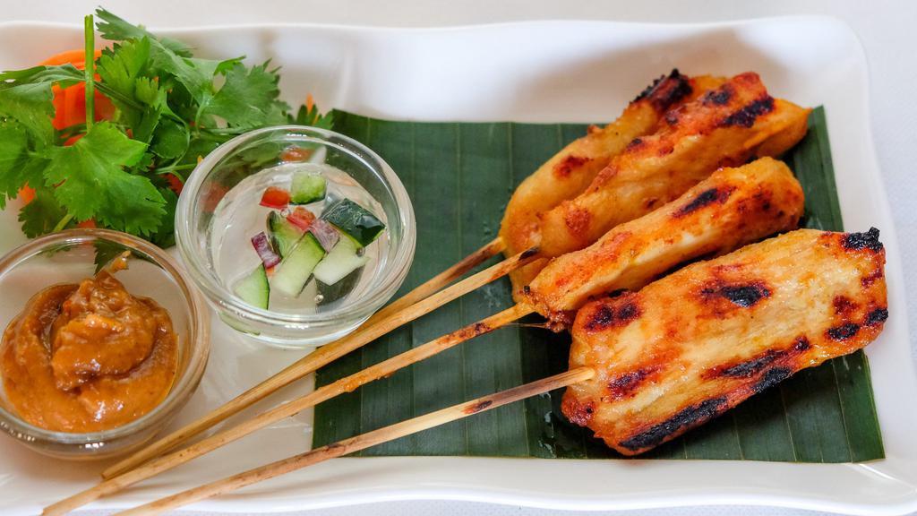 Chicken Satay · Grilled marinated chicken on skewers, served with peanut sauce, cucumber relish, and grilled brioche.