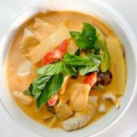 Red Curry · Spicy. Red creamy Thai chili paste with bamboo shoot, eggplant, string beans and basil leave...