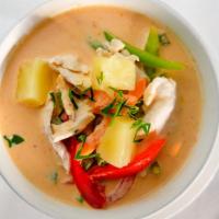 Panang Curry · Spicy. Smooth and creamy Thai Red Curry sauce with pineapple, kaffir lime leaves, string bea...