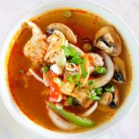 Tom Yum Soup · *Spicy* thai traditional. A spicy soup with lime juice, chili paste, mushrooms, red bell pep...