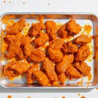 Boneless Chicken Wings (24) · 24 boneless wings with your choice of sauce. Served with celery or carrots, and blue cheese ...