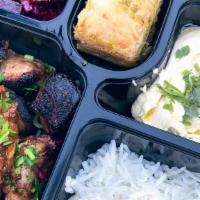 Chicken Pargiot Bento Box · Chicken Pargiot with you choice of meze, choice of side and choice of dessert.