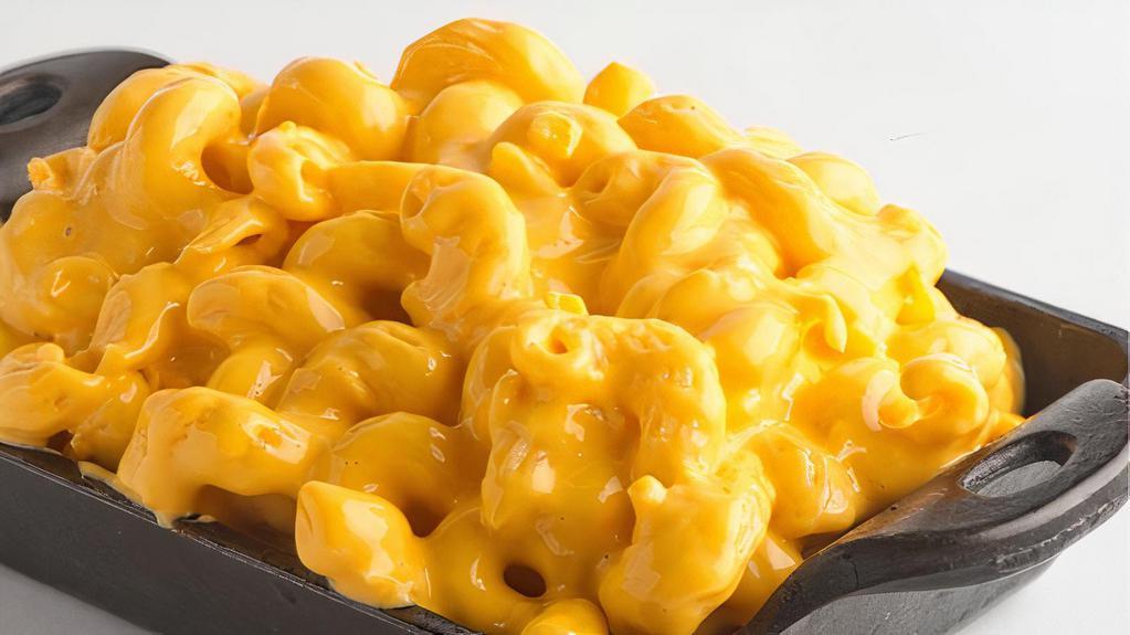 Mac & Cheese · House made cheesy macaroni and cheese.