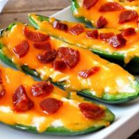 Jalapeño Poppers · Jalapeños stuffed with cheese then crisped to perfection.