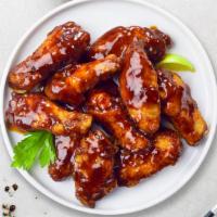 On The Grill Bbq Wings · (Ten pieces) Fresh chicken wings breaded, fried until golden brown, and tossed in barbecue s...
