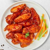 Buffalo Bliss Wings · (Ten pieces) Fresh chicken wings breaded, fried until golden brown, and tossed in buffalo sa...