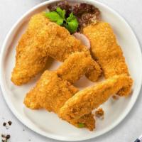 Crispy Chicken Fingers · Chicken fingers breaded and fried until golden brown.