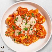 Shots For Tortellini Pasta · Fresh tortellini pasta served with a smooth creamy tomato sauce.