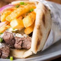 Steak Gyro With Fries Added · Delicious Gyro made with Steak, Peppers, French fries, onions, lettuce, tomato, hot sauce, a...