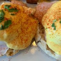Eggs Benedict · 2 poached eggs, Canadian bacon and Hollandaise sauce, over toasted English muffin, served wi...
