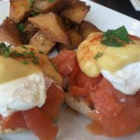 Salmon Benedict · 2 poached eggs, smoked salmon and Hollandaise sauce over toasted English muffin, served with...