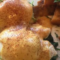 Egg Florentine · 2 poached eggs, spinach and Hollandaise sauce over toasted English muffin, served with home ...