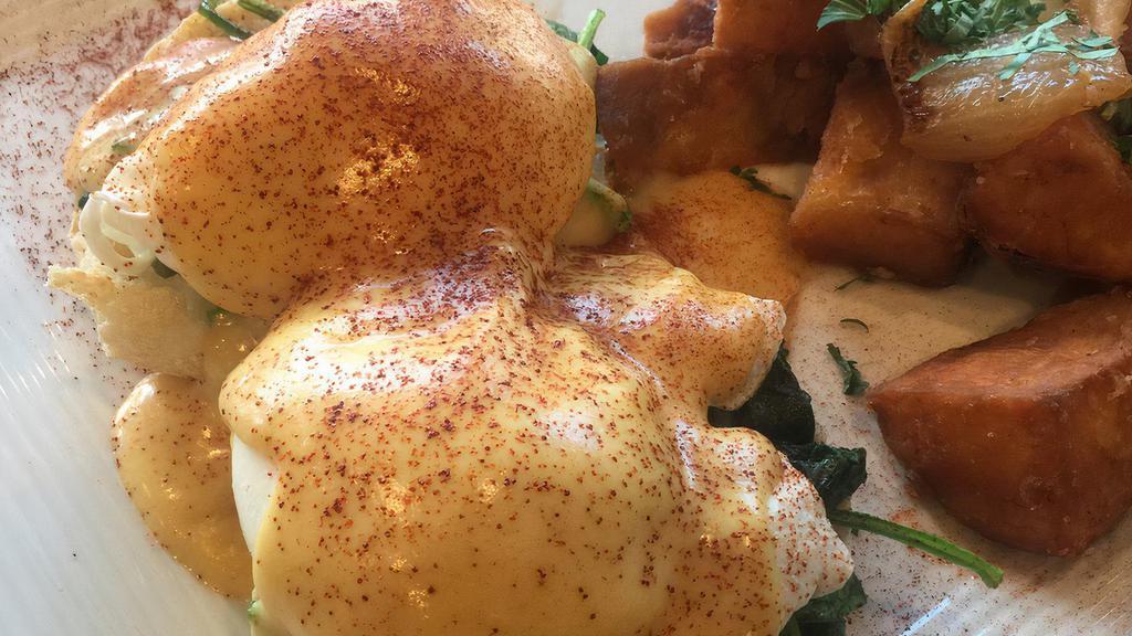 Egg Florentine · 2 poached eggs, spinach and Hollandaise sauce over toasted English muffin, served with home fries.