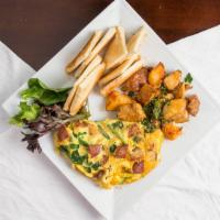 Sujuk Spinach Omelette · Sujuk (dried Mediterranean sausage), baby spinach, and goat cheese. Served with home fries a...