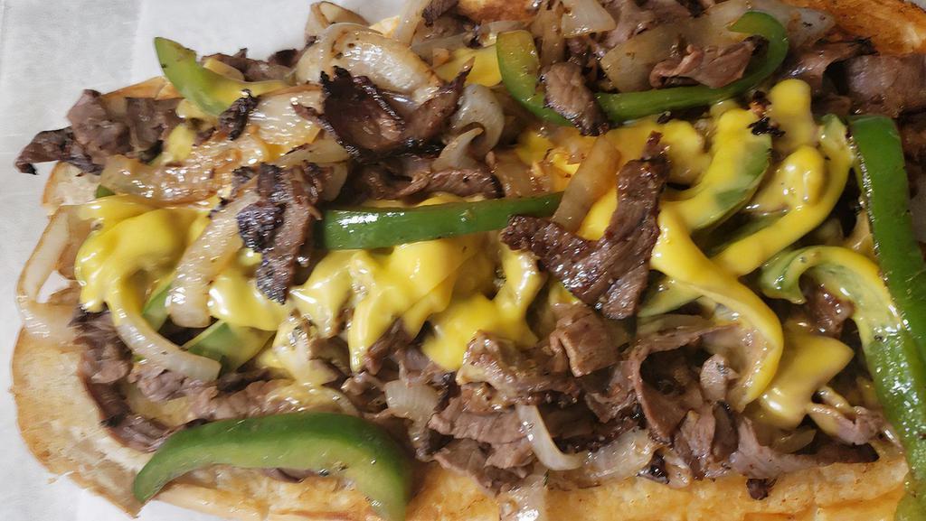 Philly Cheese Steak · Hot Roast Beef, Onions, Green Peppers, Smothered in Cheddar Cheese