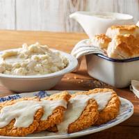Country-Fried Steak Family Meal  · Six pieces of Country-Fried Steak topped with country gravy and served with 2 family size si...