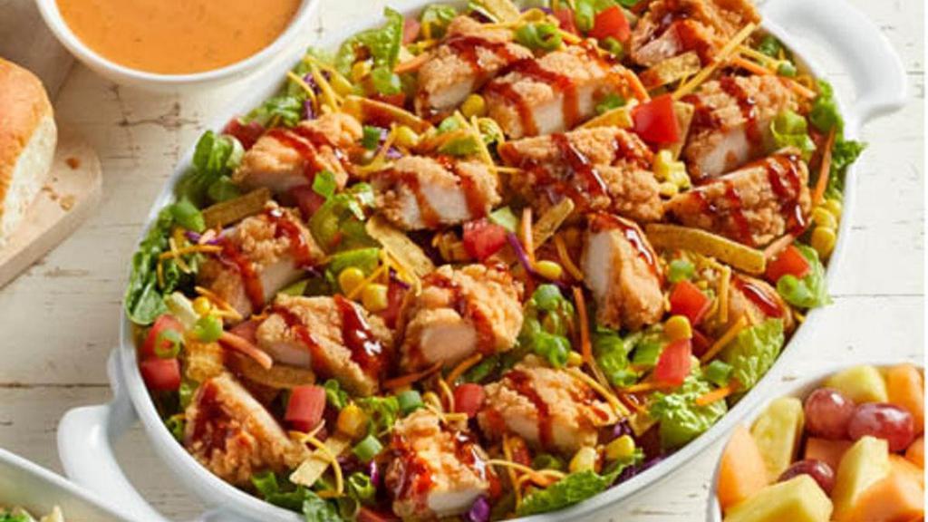 Family Size Bob Evans Wildfire® Chicken Salad · Fresh greens topped with Homestyle fried or grilled chicken, corn, diced tomato, crisp green onions, cheddar cheese, tortilla strips and a drizzle of Bob Evans Wildfire® sauce. Pairs well with Wildfire® ranch dressing and served with dinner rolls.