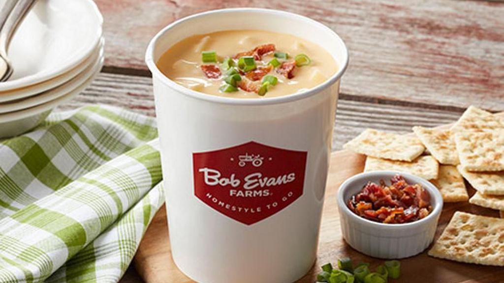 Family Size Cheddar Baked Potato Soup · Large cuts of potato, cured ham, onion, celery and carrots blended together in a perfectly seasoned, satisfying, sharp cheddar cheese base. Topped with bacon. Serves four.