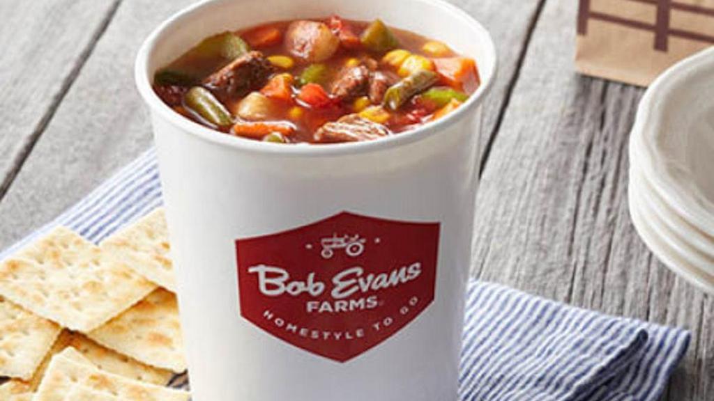 Family Size Hearty Beef Vegetable Soup · Tender beef cooked in a tomato broth loaded with carrots, corn, tomatoes, potatoes, celery and onions in a family size serving for 4.