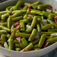 Family Size Green Beans With Ham  · Slow-simmered with ham, onions, salt & pepper. Serves up to 6.