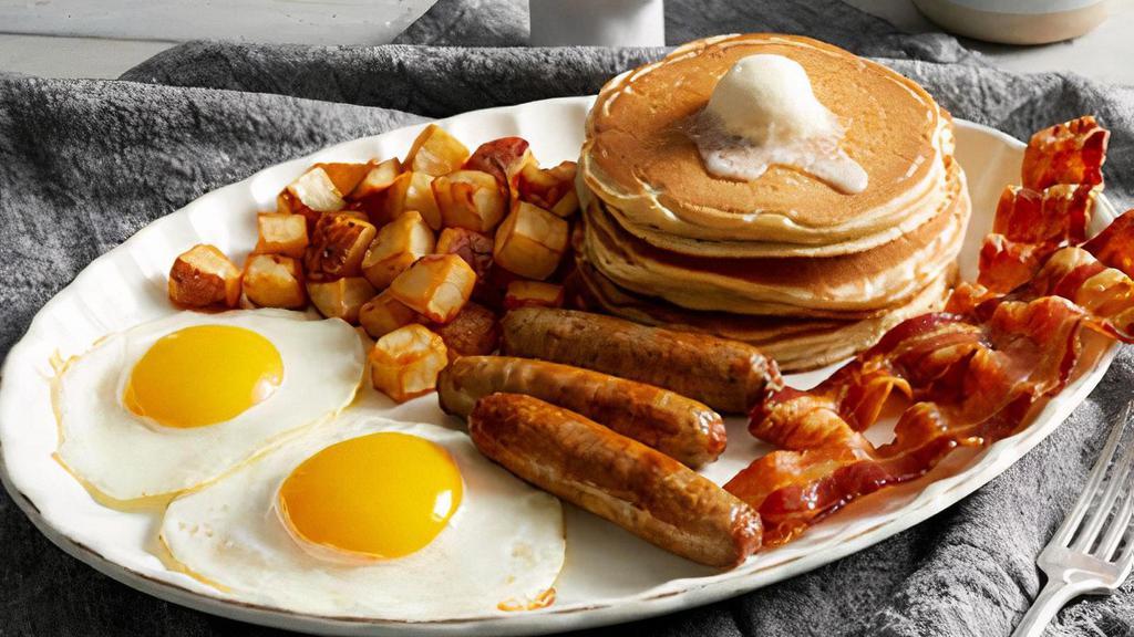 Double Meat Farmer · Bob Evans® sausage and hardwood-smoked bacon with two fresh-cracked eggs* cooked-to-order and your choice of  hash browns, home fries or fresh-cut fruit. Served with three hotcakes or two slices of Brioche French toast