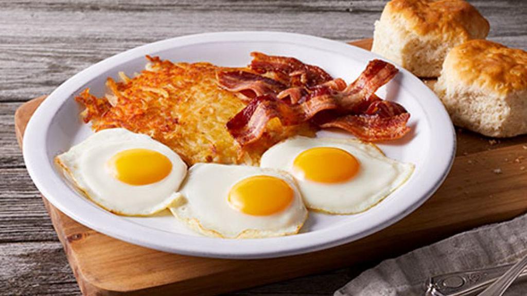 The Big Egg Breakfast · Three fresh-cracked eggs* cooked-to-order with your choice of premium breakfast meat, choice of hash browns or home fries and freshly-baked biscuits
