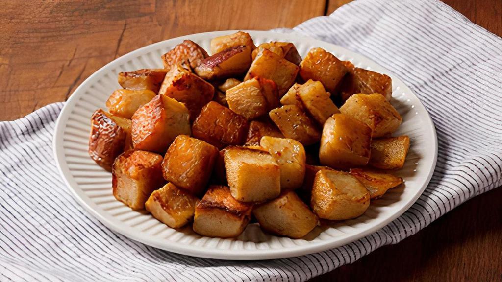 Golden Brown Home Fries · Hearty chunks of red-skinned potatoes, lightly seasoned.