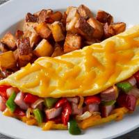 Western Omelet · Filled with hickory-smoked ham, sautéed onions, red & green bell peppers and cheddar cheese....