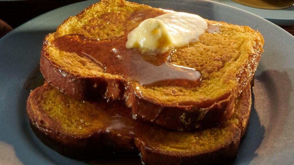 Brioche French Toast · Two slices of Brioche bread, hand-dipped in egg batter, vanilla and cinnamon then griddled. Served with butter and syrup and topped with powdered sugar. Served with your choice of premium breakfast meat or fresh fruit
